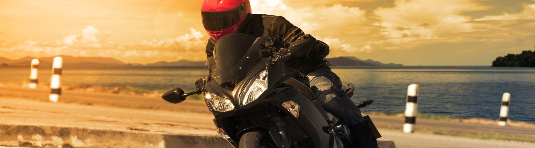 person riding motorcycle on road